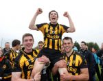 Ballycastle's Conor McGarry is chaired from the field by team captain Paul McLeron (2) and centre-forward James McLister after his late point gave Ballycastle victory over Cushendall in the Under 21 Hurling final in Loughgiel. 