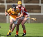 Antrim's Michael Armstrong breaks clear of Armagh's Conor Devlin during Wednesday evening's Ulster U21 Hurling semi-final in Pairc Esler - Pic by John McIlwaine