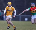 Simon McCrory soloes away from Carlow's Damian Roberts to score a point during Antrim's NHL Div 2 win at Casement Park. 