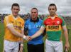 Antrim captain Eddie McCloskey and his Carlow counterpart Paudie Kehoe with match referee James McGrath before the start of Saturday's All Ireland Hurling Qualifier at Casement Park.