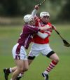 Loughgiel's Seamus Dobbin and Cushendall's Eoin Laverty in action during Monday evening's Minor Hurling Championship semi-final in Ballycastle. Pic by John McIlwaine