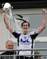 All Saints captain Damian Kelly lifts the Intermediate Football Championship Cup after his team's win over Portglenone in Sunday's final in Creggan