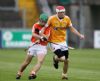 Antrim corner-back Christopher Murray comes out with the ball