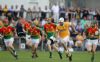 Neill McManus is chased by five Carlow opponents as he solos towards goal