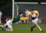 Antrim's Kevin Brady goes past the challenge of Meath's Brian Meade during Saturday evening's Allianz NFL Division 2 game at Casement Park. Pic by John McIlwaine