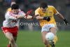 Antrim's Brian Neeson has his shot blocked down during Sunday's McKenna Cup game at Casement Park. 