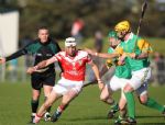 Loughgiel's Liam Watson is tackled by Dunloy's Kevin Molloy and Conor Cunning during his team's senior hurling championship semi-final win over the Cuchullains at Pairc MacUillin, Ballycastle on Sunday evening.