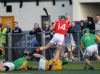 Dunloy goalkeeper Gareth McGhee dives in to knock the ball away from Lougghiel's Joey Scullion during Sunday evening SHC semi-final in Ballycastle.
