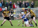St John's Barry McFall hand passes the ball away as Ballycastle's Steven mcGarry, Kieran Kelly and Shane Staunton close in during Saturday evening's SHC quarter-final in Loughgiel.