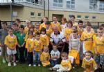 Antrim manager Liam Bradley with some of the army of young fans who turned up to Monday evening's 'meet the fans' night in Creggan