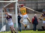 Antrim corner-forward PJ O'Connell bats the ball past Wexford goalkeeper Damian Fitzhenry for his team's opening goal in Sunday's 4-16 to 4-12 NHL win at Casement Park. Pic by John McIlwaine