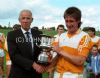 Danny McKinley receives the U21 Cup from Ulster vice-chairman Gene Larkin of Crossmaglen Rangers after the Ulster final win of 1988