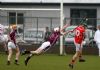 Man of the match Donal 'Natty' Mcnaughton makes a brilliant diving block to deny Loughgiel's Joey Scullion in Sunday evening's Senior Feis Cup semi-final in Dunloy.
