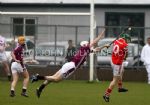 Man of the match Donal 'Natty' Mcnaughton makes a brilliant diving block to deny Loughgiel's Joey Scullion in Sunday evening's Senior Feis Cup semi-final in Dunloy.
