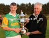 North Antrim chairman James McLean presents the Senior Feis Cup Hurling cup to Dunloy captain Liam Richmond after his team's win over Cushendall in the final at Feis na nGleann in Ballymena. 