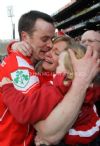 Tears of joy! Loughgiel corner back Ding Gillen greets his wife Lisa and daughter Aoibheann after the Shamrocks victory. 