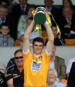 Antrim captain Matthew Donnelly holds the Danny McNaughton Memorial Cup aloft after his team's win over Armagh in Sunday's Ulster Minor Hurling Championship final at Casement Park. Pic by John McIlwaine