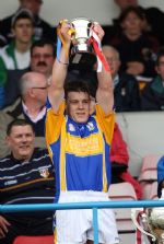 Rossa captain Stephen Shannon lifts the Minor Hurling Championship cup after his team's win over Loughgiel in Sunday's final at Casement Park. Pic by John McIlwaine