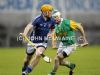 St Gall's centre-back CJ McGourty breaks away from Dunloy's Alastair Elliott to clear the ball upfield during Wednesday evening's Antrim Senior Hurling Championship replay which the Belfast side won by 1-12 to 1-9.