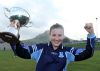 St Louis captain Aimee McAtamney lifts the Fr Davies Cup after her team's win over St Lillians in Saturday's final in Cushendall. Pic by John McIlwaine