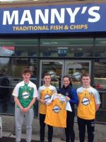 Jane Adams of Mannys presents new jerseys to U16 hurlers 