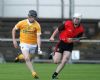 Antrim's Michael Armstrong gets away from Down's Matthew Conlon during Wednesday evening's Ulster U21 semi-final at Casement Park. Pic by John McIlwaine
