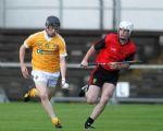 Antrim's Michael Armstrong gets away from Down's Matthew Conlon during Wednesday evening's Ulster U21 semi-final at Casement Park. Pic by John McIlwaine