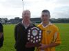 Ciaran Johnston captain being presented with M Foley Shield