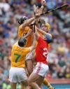 Antrim full-back Cormac Donnelly plucks the ball out of the air in this aerial batle with Cork's Patrick Horgan and the Antrim duo of Ciaran Herron and Simon McCrory