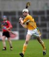 Joey Scullion strikes an Antrim point early in the first half.