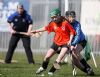 Louise McKeown holds off the challenge of a Loughrea opponent to win possession