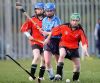 Louise McKeown loses her hurl in this tussle with the Loughrea defence