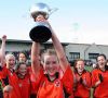 Team captain Rebecca Walsh proudly lifts teh All Ireland Cup 