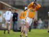 Antrim full-forward Kieran Kelly, who scored Antrims second goal direct from a twenty metre free, holds his head in his hands after his ground stroke went inches wide of the Wexford goal. 