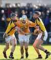Neil McManus breaks through the challenge of Wexfords Mick Jacob and David OConnor during Sundays NHL win over the Slaneysiders at Casement Park. 