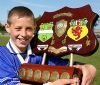 St John's goal hero Conor Johnston with the Feile trophy at the end.
