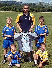 Football coach Colm Brady with kids at Lisburn Cul Camp